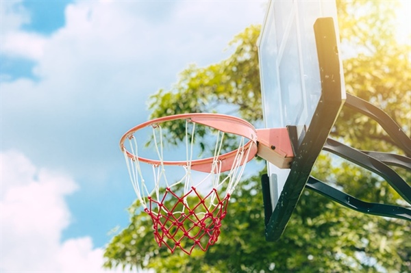 Driveway Basketball vs. a Dedicated Backyard Court: Which is Right for Your Family?